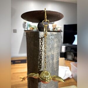 , A brand new gold keychain featuring